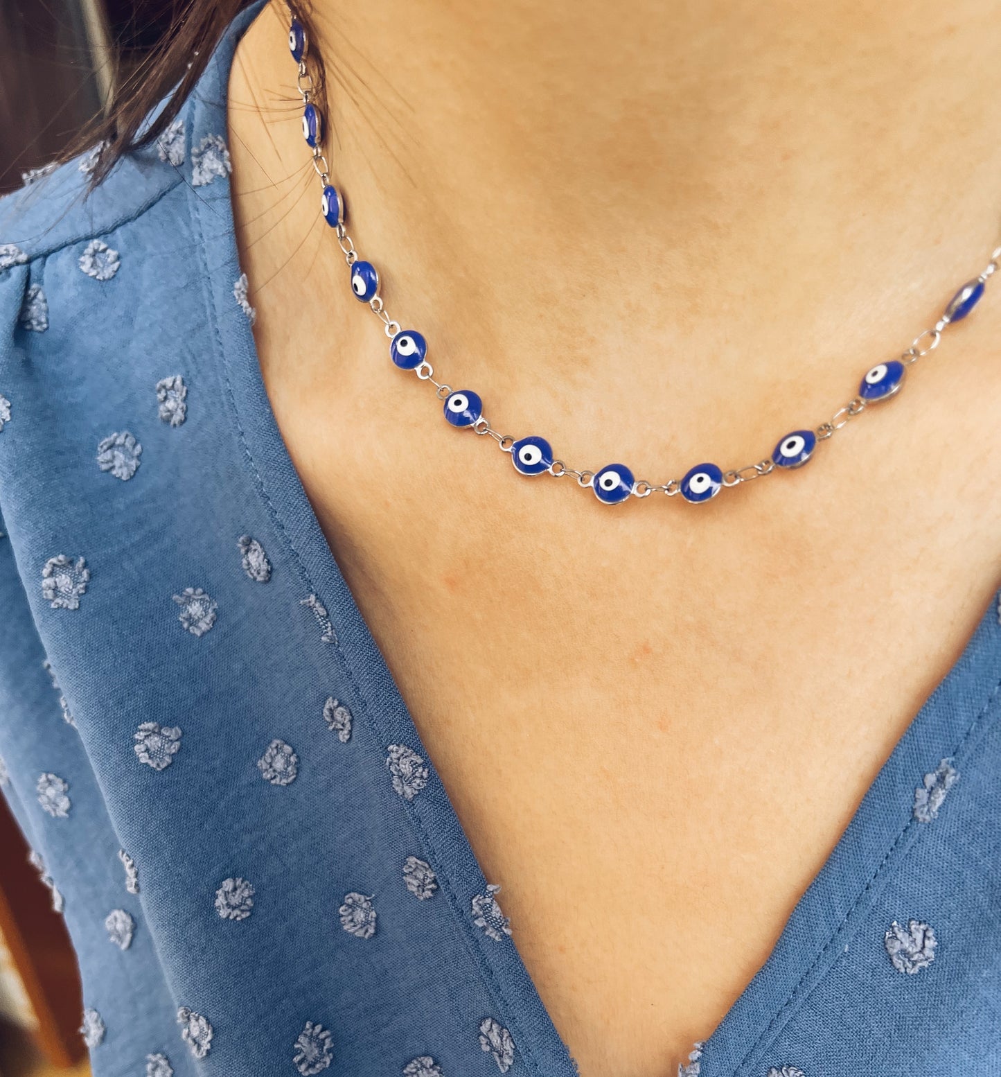 Collana in acciaio con occhi blu smaltati