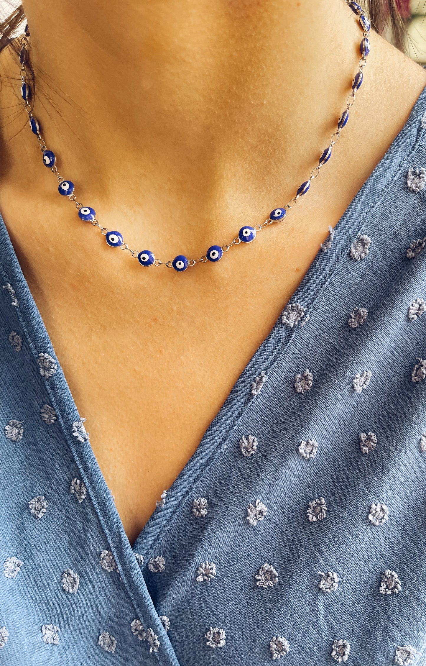 Collana in acciaio con occhi blu smaltati