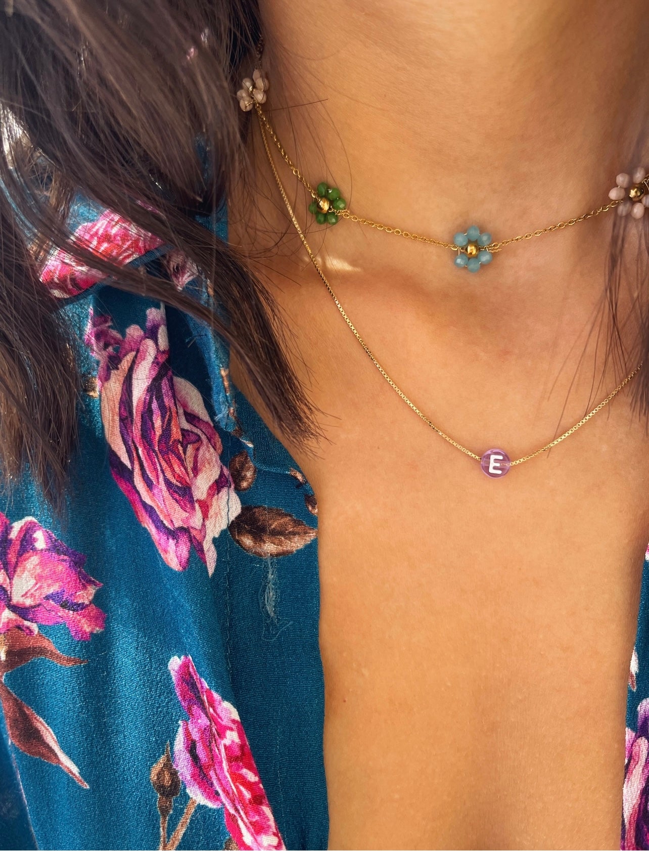 Collana in acciaio con margherite con perline