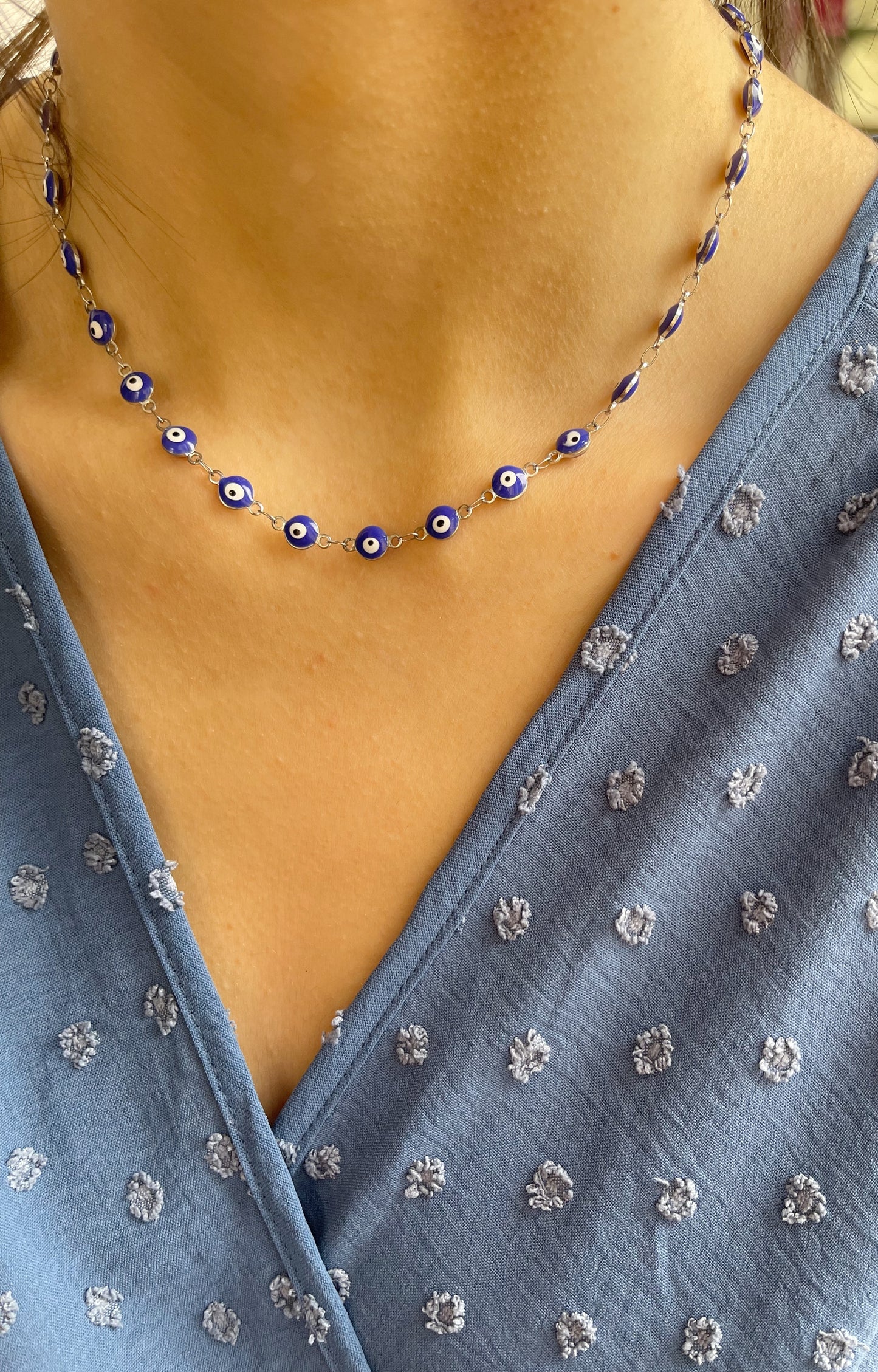 Collana in acciaio con occhi blu smaltati
