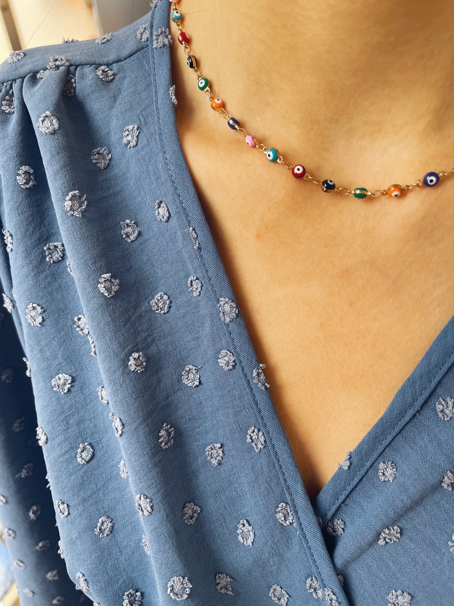 Collana in acciaio con occhi smaltati