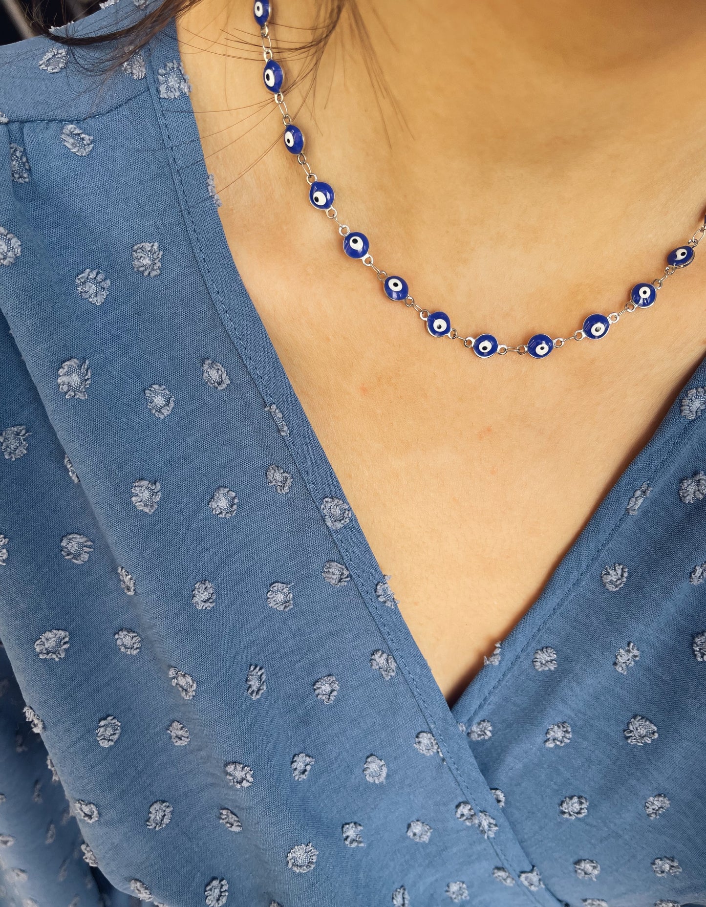Collana in acciaio con occhi blu smaltati