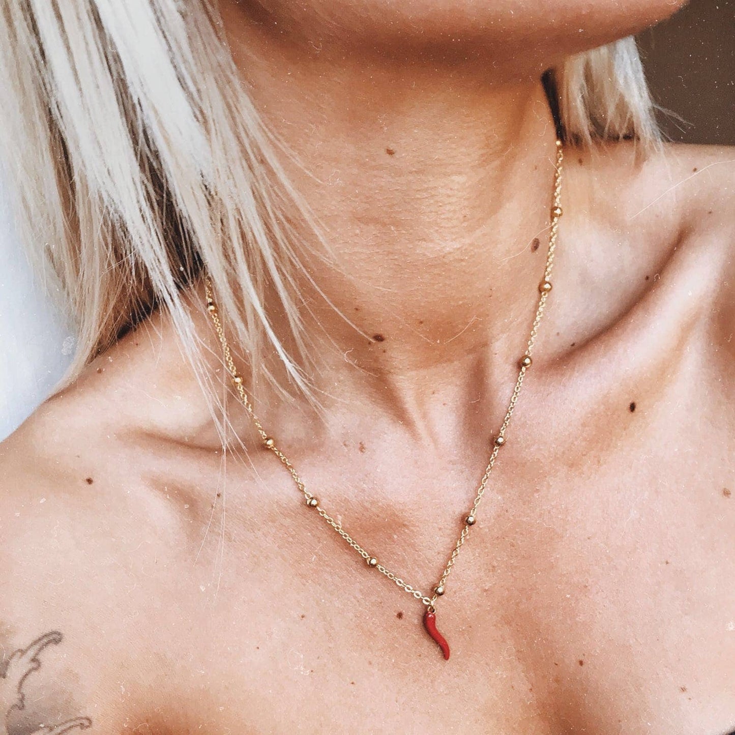 Collana in acciaio con cornetto