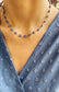 Collana in acciaio con occhi blu smaltati