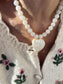 Collana con perline e cuore in resina