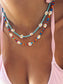 Collana con perline in vetro e margherite