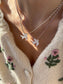 Collana con cordino in cotone e colomba in madreperla