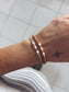 Bracciali con pietre dure e perle di fiume