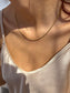 Collana a filo in acciaio dorato