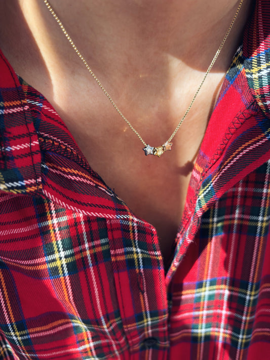 Collana in acciaio con stelline in tre colori