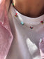 Collana in acciaio con margherite multicolor