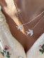 Collana con cordino in cotone e colomba in madreperla