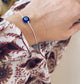 Bracciale con cordoncino e occhio portafortuna - Dettagli di Moda