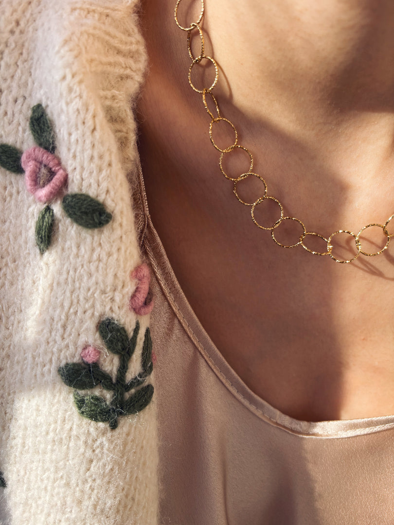 Collana con catena ad anelli in acciaio dorato