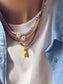 Collana con perline in vetro e margherita in madreperla