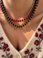 Collana con rondelle in granato e perline in acciaio dorato