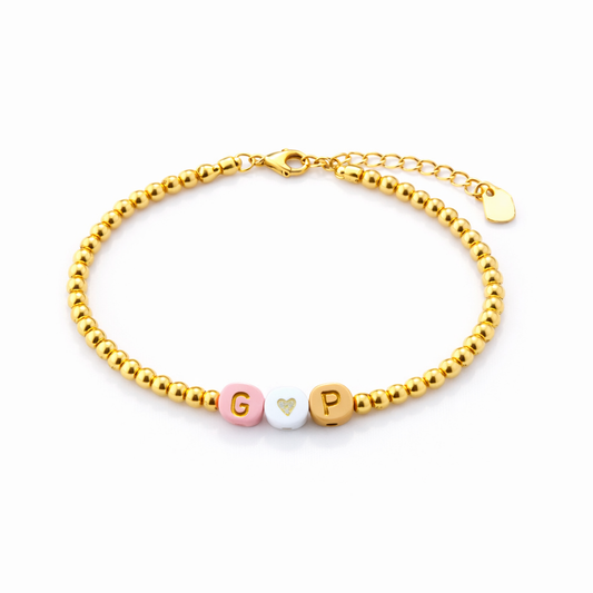 Bracciali con perline in acciaio e letterine da personalizzare