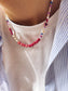 Collana con perline in vetro e letterine - magenta