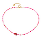 Collana con perline in vetro e fragola centrale