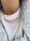 Collana con catena figaro in acciaio dorato - Dettagli di Moda