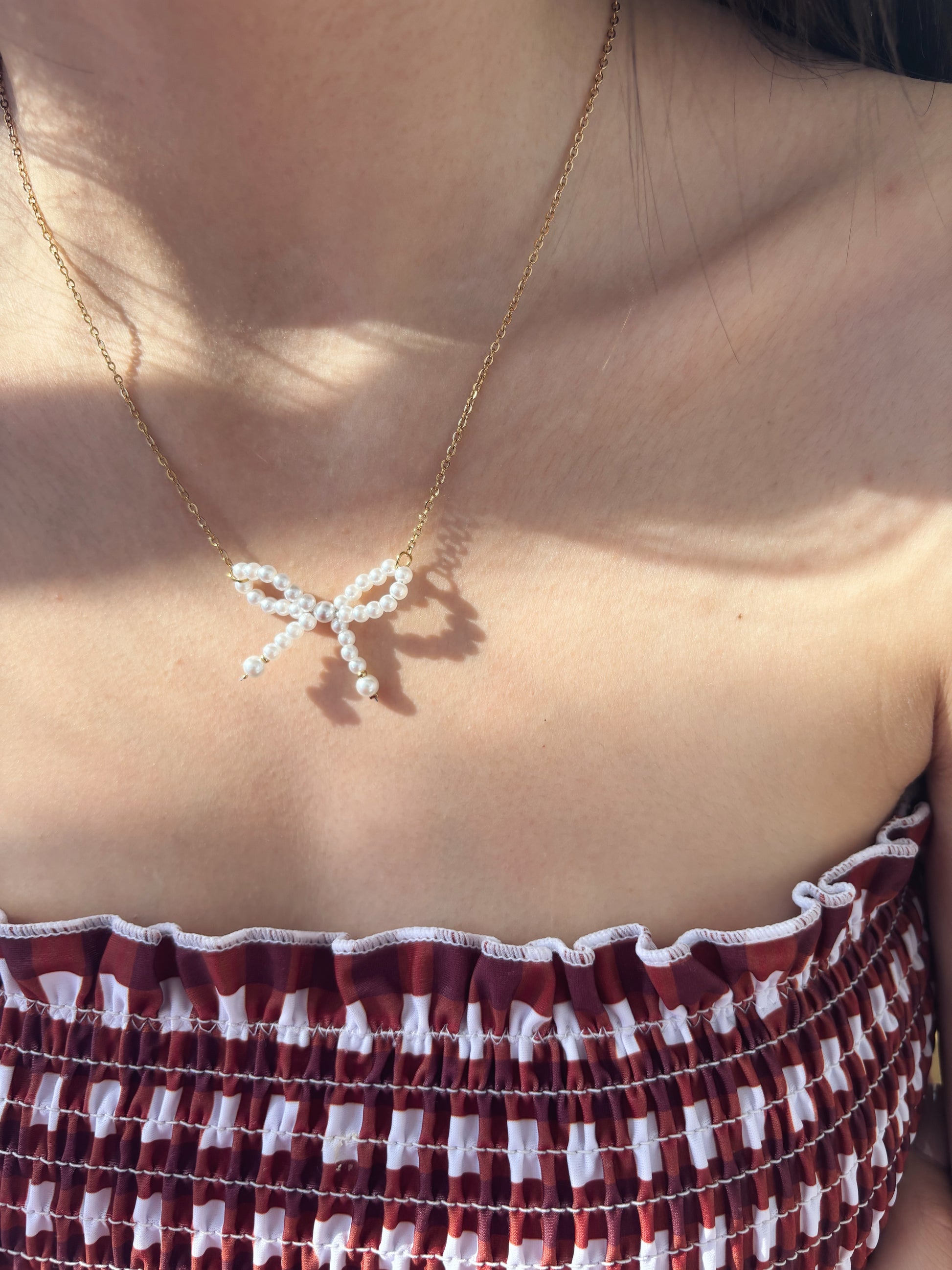 Collana in acciaio con fiocco di perline - Dettagli di Moda