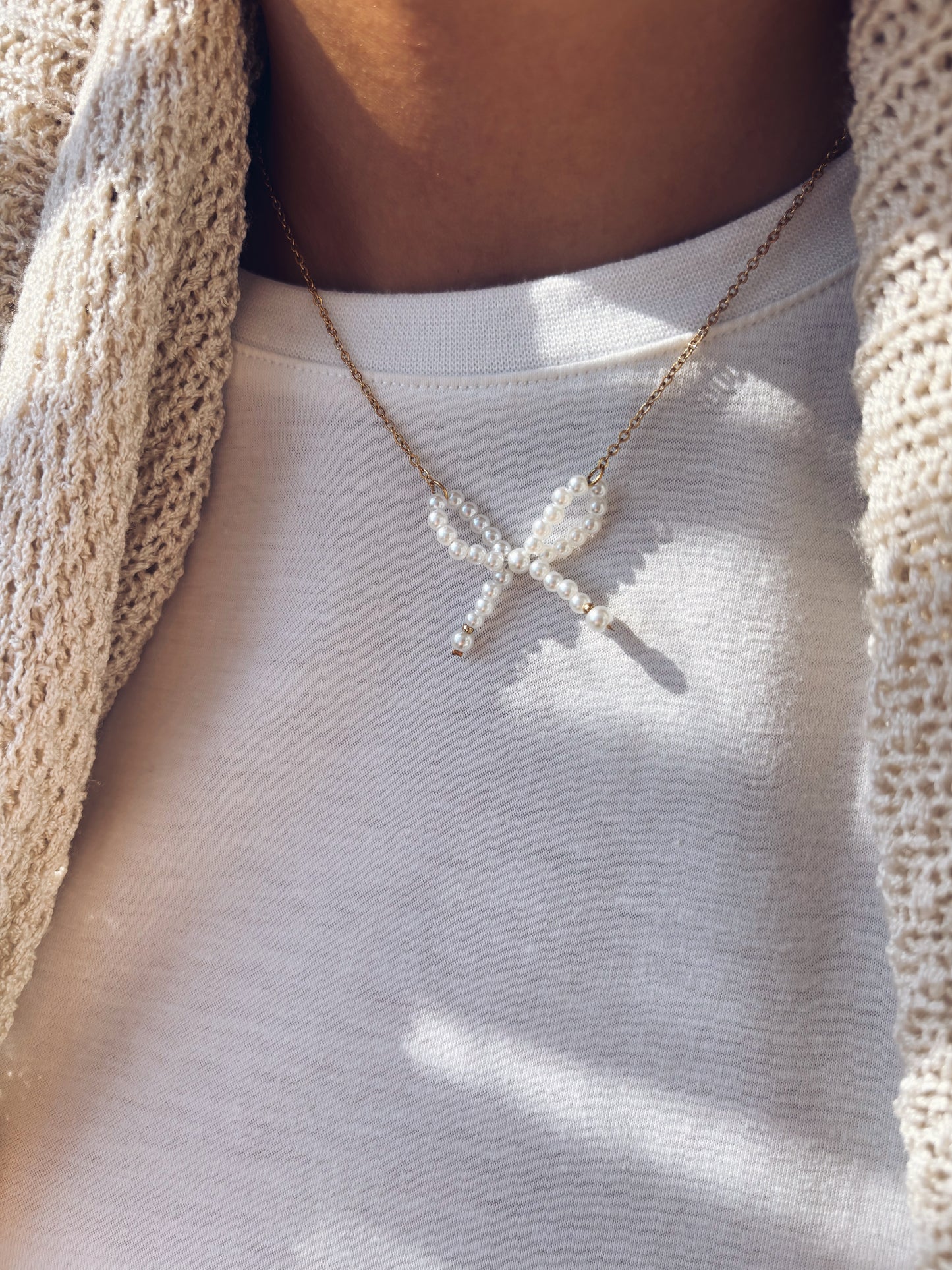 Collana in acciaio con fiocco di perline