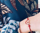 Bracciale con cordoncino e cuore smaltato